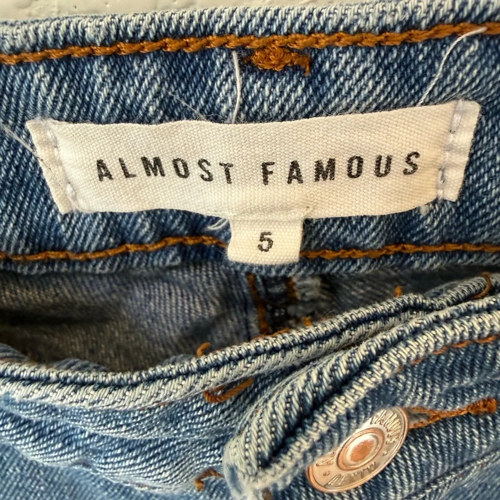 Almost Famous women's Light Blue Distressed flared Jeans